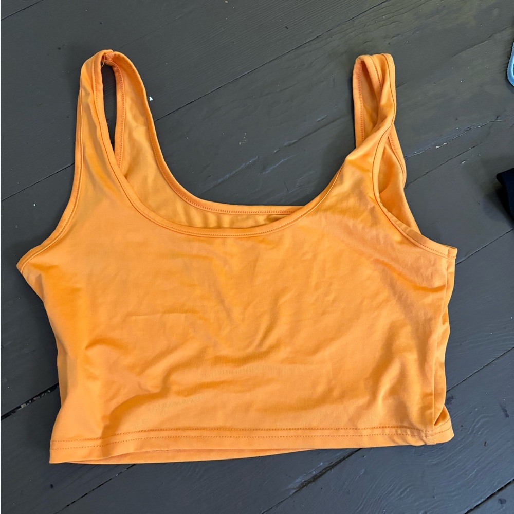 bright orange top